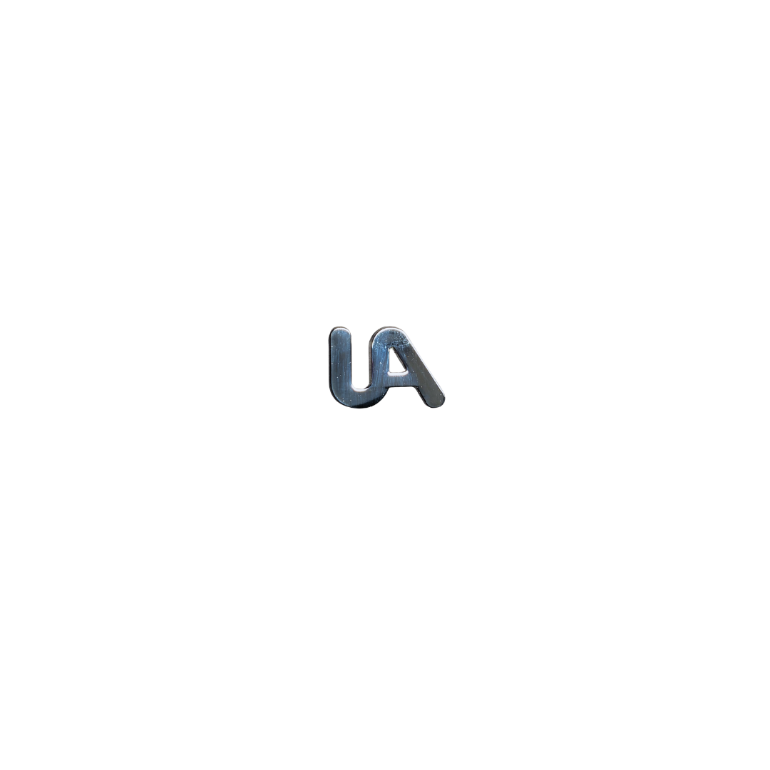 Silver UA cutout lapel pin on a white background.